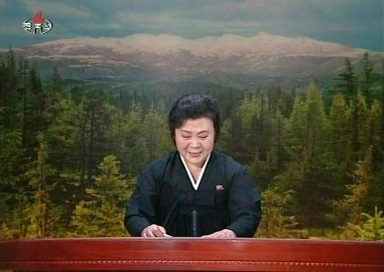 Image: A tearful announcer dressed in black announces the death of North Korean leader Kim Jong-il on North Korean State Television
